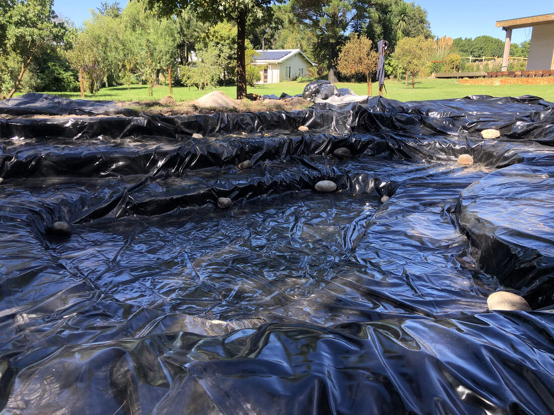 Laying the pond liner